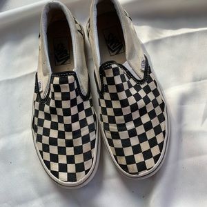 Vans black and white slip on.